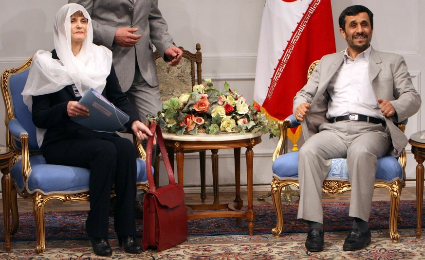 Iranian President Mahmoud Ahmadinejad, right, looks on during a meeting with Swiss Foreign Minister Micheline Calmy-Rey, left, in Tehran, Iran, Monday March 17, 2008. Swiss energy trading company EGL  ...