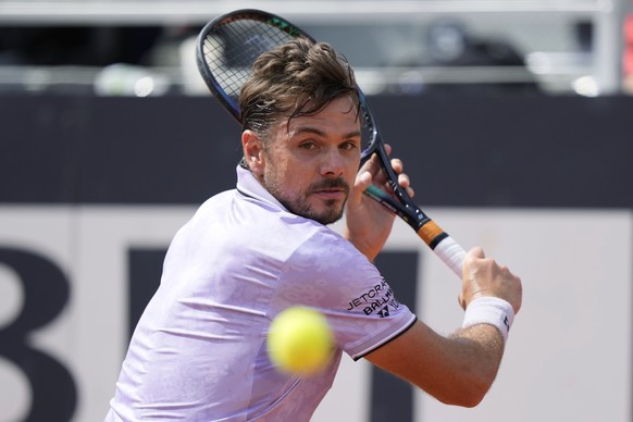 Switzerland&#039;s Stan Wawrinka returns the ball to Bulgaria&#039;s Grigor Dimitrov during their match at the Italian Open tennis tournament, in Rome, Friday, May 12, 2023. (AP Photo/Andrew Medichini ...