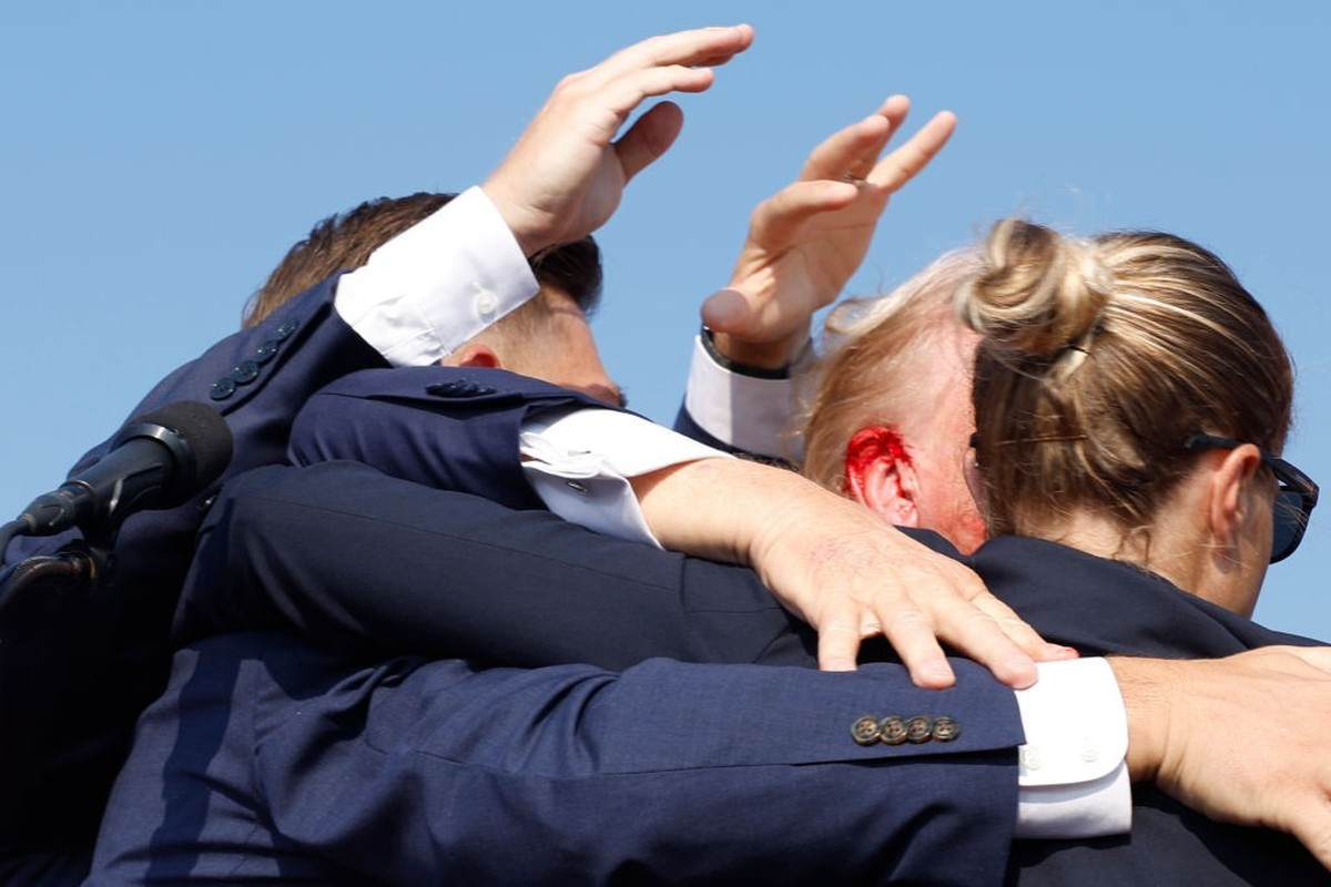 BUTLER, PENNSYLVANIA - JULY 13: Republican presidential candidate former President Donald Trump is rushed offstage during a rally on July 13, 2024 in Butler, Pennsylvania. Butler County district attor ...