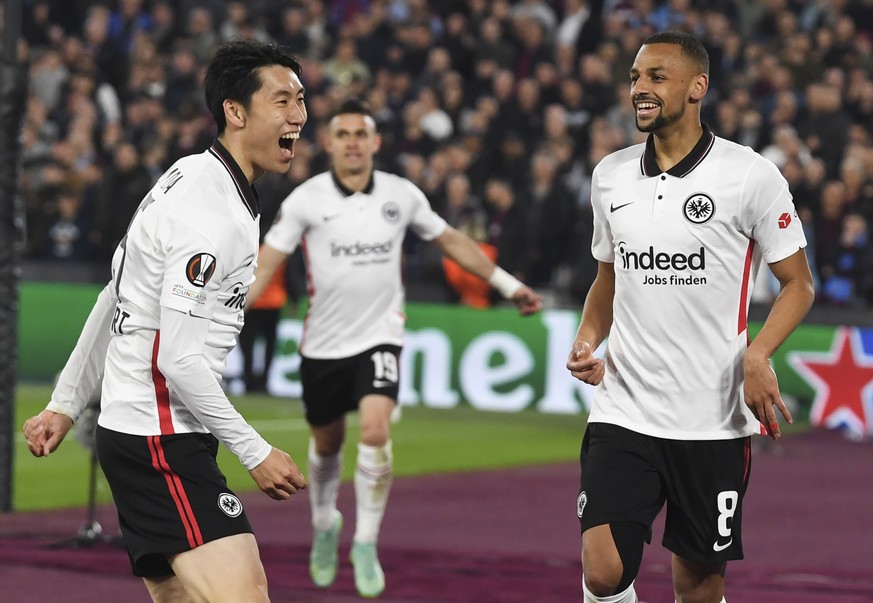 epa09915201 Daichi Kamada (L) of Eintracht Frankfurt celebrates with teammate Djibril Sow (R) after scoring the 1-2 lead during the UEFA Europa League semi final, first leg soccer match between West H ...