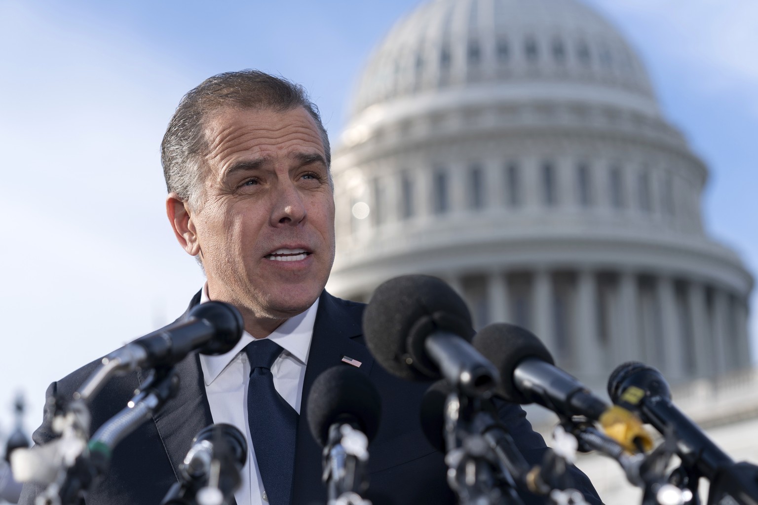 Hunter Biden, son of U.S. President Joe Biden, talks to reporters at the U.S. Capitol, in Washington, Wednesday, Dec. 13, 2023. Hunter Biden lashed out at Republican investigators who have been diggin ...