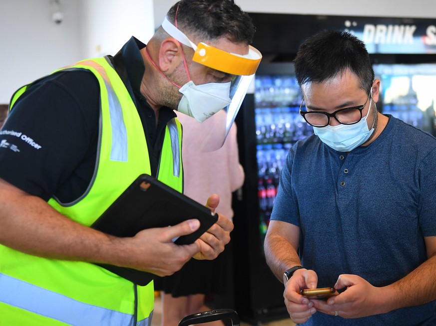 QUARANTINE FREE INTERNATIONAL ARRIVALS MELBOURNE, Department of Health authorised Officers check passenger permits after Jetstar flight JQ505 from Sydney landed at Tullamarine Airport in Melbourne, Mo ...