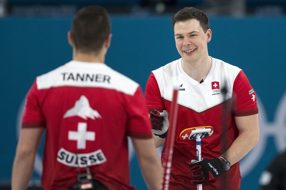 Valentin Tanner and Claudio Paetz of Switzerland, from left, in action during the Curling Bronze Medal game of the men between Switzerland and Canada at the XXIII Winter Olympics 2018 in Gangneung, So ...