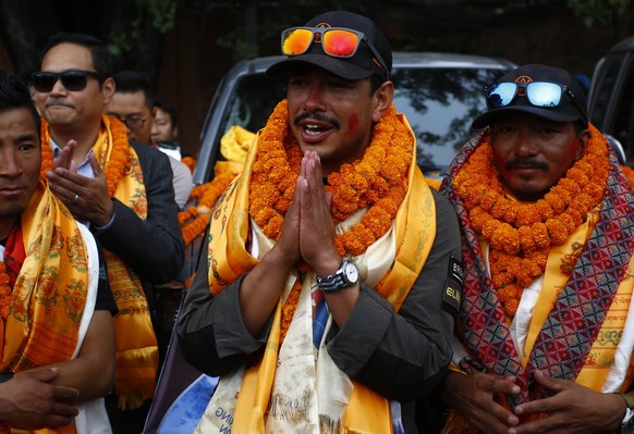 October 30, 2019, Kathmandu, Nepal: Nirmal Nims Purja 36 along with his team of Project Possible gesture upon their arrival after successfully scaling all 14 mountains above 8,000 m in just over six m ...