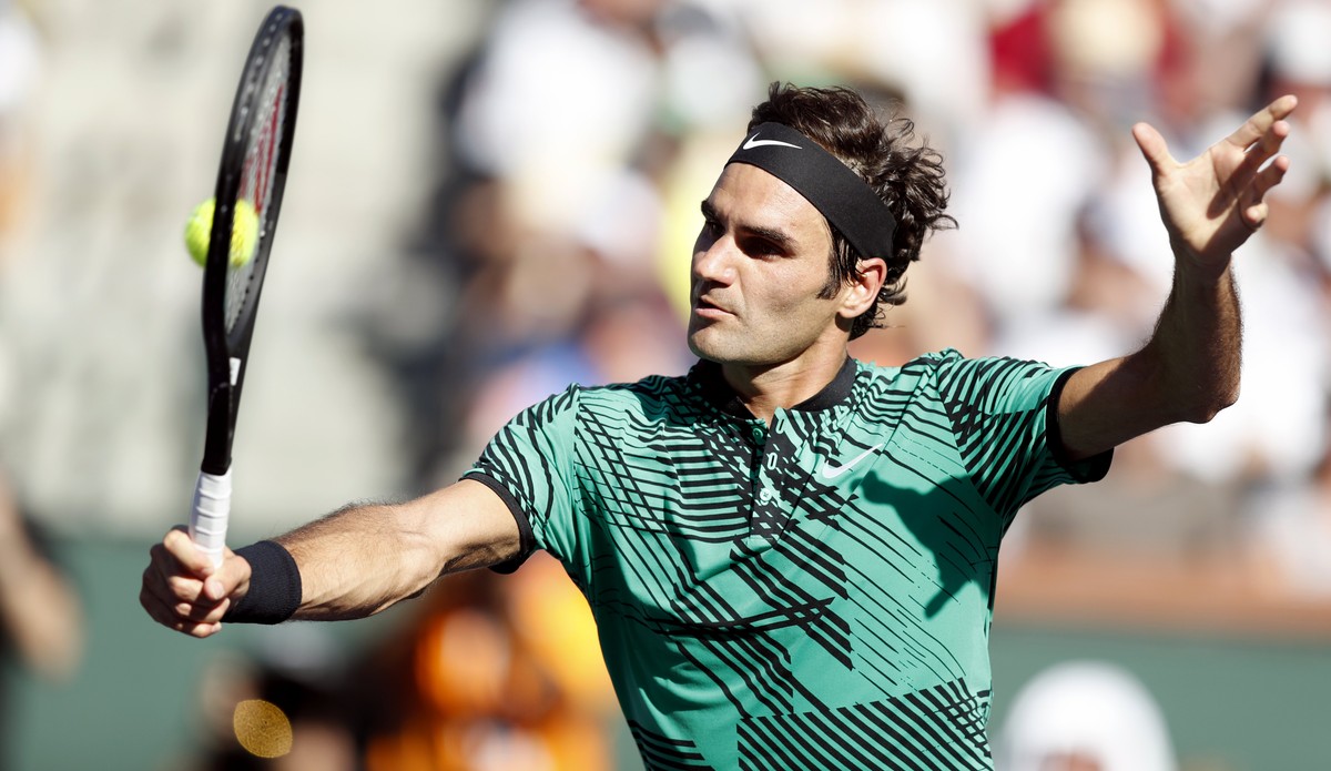 epa05858984 Roger Federer of Switzerland in action against Stan Wawrinka of Switzerland during their men's final match at the 2017 BNP Paribas Open tennis tournament at the Indian Wells Tennis Ga ...