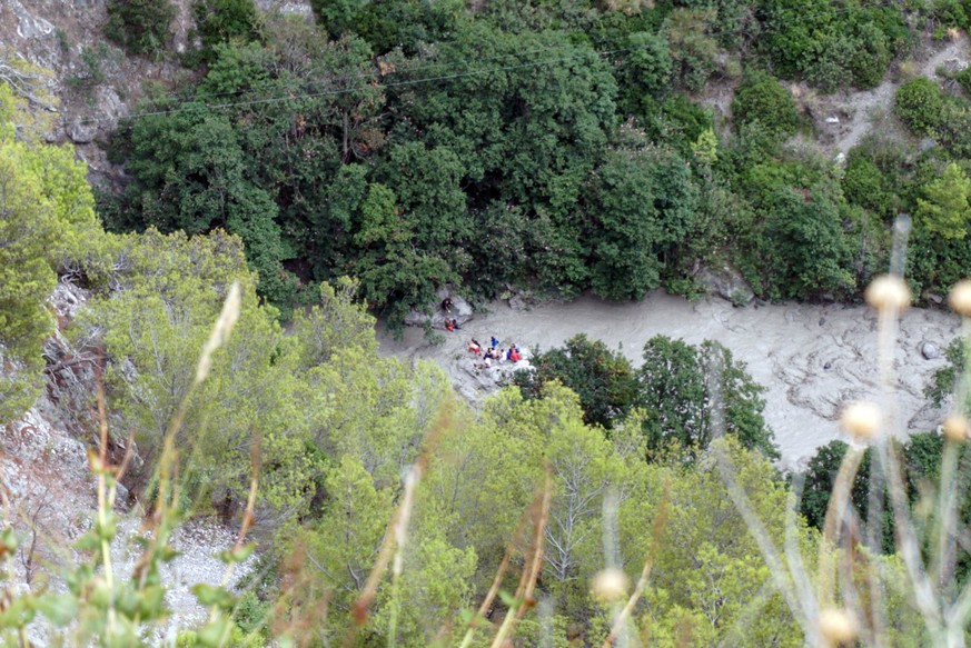 Rescuers work at the Raganello Gorge in Civita, Italy, Monday, Aug. 20, 2018. At least eight people were killed when heavy rain flooded a gorge filled with hikers in the southern region of Calabria, I ...