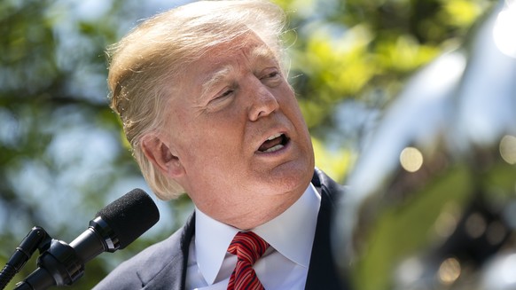 epa06704937 US President Donald J. Trump presents the Commander-in-Chief&#039;s Trophy to the U.S. Military Academy football team in the Rose Garden of the White House in Washington, DC, USA, 01 May 2 ...