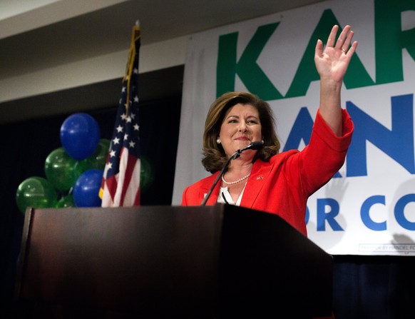 epa06040100 US House of Representatives candidate Karen Handel waves to supporters during an election party in Atlanta, Georgia, USA, 20 June 2017. Handel faces Democrat Jon Ossoff in the expensive an ...