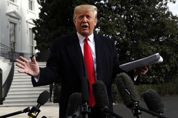 President Donald Trump talks to the media on his way to the Marine One helicopter, Wednesday, Nov. 20, 2019, as he leaves the White House in Washington, en route to Texas. (AP Photo/Jacquelyn Martin)
 ...