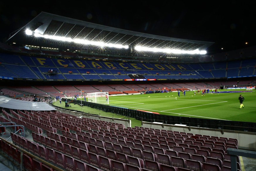 View of the empty stands prior the start of the Spanish La Liga soccer match between Barcelona and Eibar at the Camp Nou stadium in Barcelona in Barcelona, Spain, Tuesday, Dec. 29, 2020. (AP Photo/Joa ...