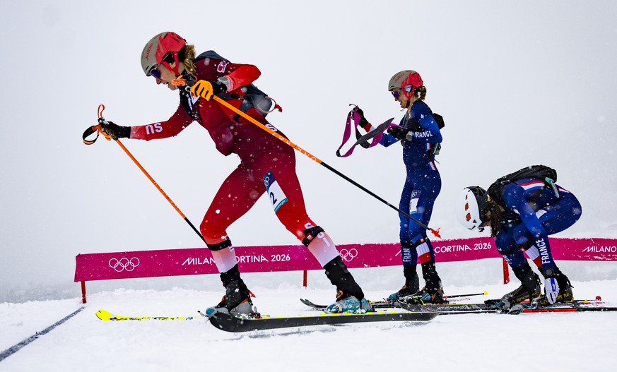 Switzerland's Marianne Fatton, left, stars her descend during the women's Ski Mountaineering sprint final at the 2026 Olympic Winter Games at the Stelvio Ski centre in Bormio, Italy, on Thur ...