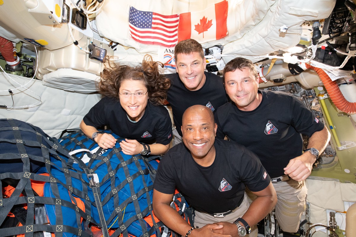 In this image provided by NASA, the Artemis II crew, clockwise from left, Mission Specialist Christina Koch, Mission Specialist Jeremy Hansen, Commander Reid Wiseman, and Pilot Victor Glover, pause fo ...