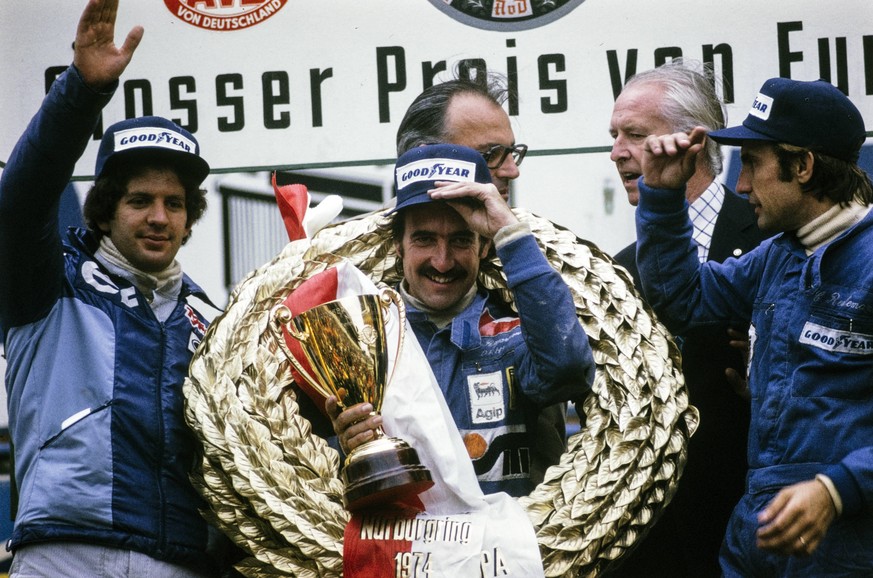 IMAGO / Motorsport Images

1974 German GP NüRBURGRING, GERMANY - AUGUST 04: Clay Regazzoni celebrates victory on the podium with Jody Scheckter, 2nd position and Carlos Reutemann, 3rd position during  ...