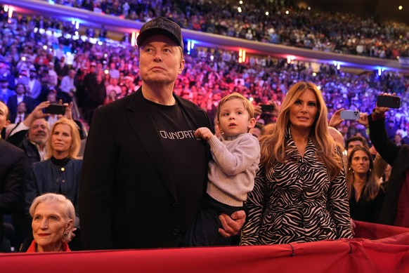 Elon Musk and former first lady Melania Trump listen as Republican presidential nominee former President Donald Trump speaks at a campaign rally at Madison Square Garden, Sunday, Oct. 27, 2024, in New ...