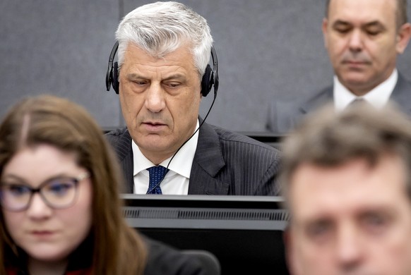 Former Kosovo president Hashim Thaci, left, appears before the Kosovo Tribunal as he defends himself against charges including murder, torture and persecution allegedly committed during his country&#0 ...