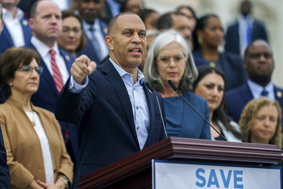 epa12417396 US House Minority Leader Hakeem Jeffries (C) speaks to the media on the steps of the House of Representatives at the US Capitol, Washington, DC USA, 30 September 2025. House and Senate Dem ...
