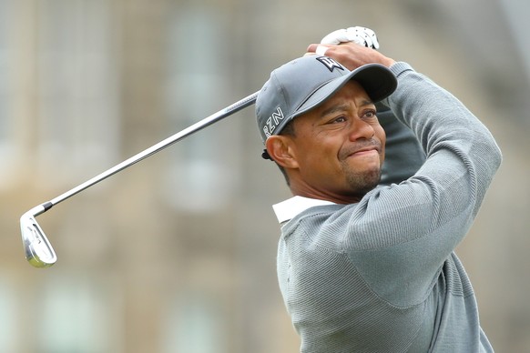 ST ANDREWS, SCOTLAND - JULY 16: Tiger Woods of the United States tees off on the 2nd hole during the first round of the 144th Open Championship at The Old Course on July 16, 2015 in St Andrews, Scotla ...