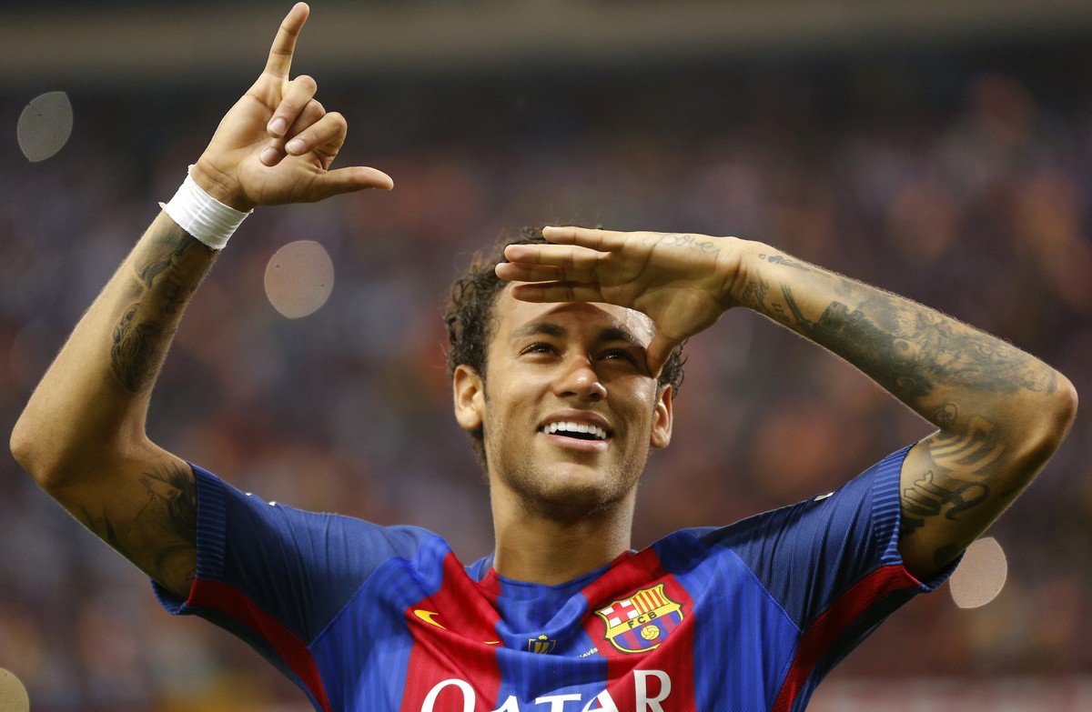 Barcelona's Neymar celebrates at the end of the Copa del Rey final soccer match between Barcelona and Alaves at the Vicente Calderon stadium in Madrid, Spain, Saturday May 27, 2017. (AP Photo/Dan ...