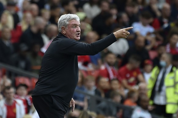 Newcastle&#039;s head coach Steve Bruce gestures during the English Premier League soccer match between Manchester United and Newcastle United at Old Trafford stadium in Manchester, England, Saturday, ...