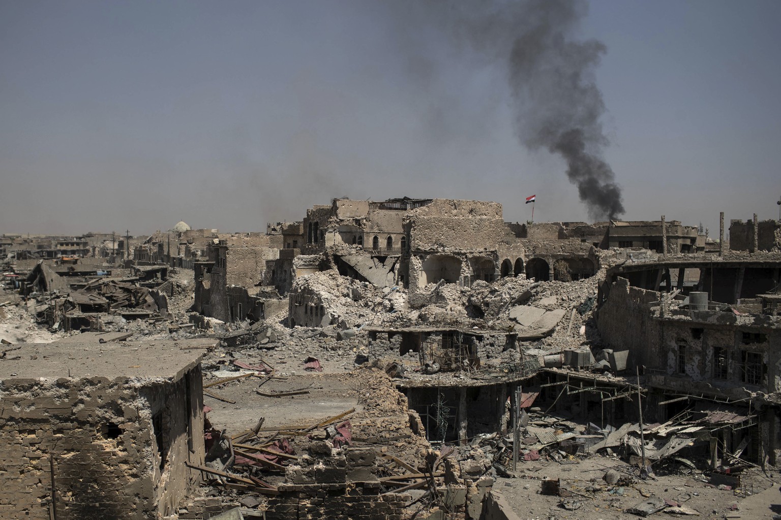 Smoke from an explosion rises during fighting against Islamic State militants in the old city of Mosul, Iraq, Friday, June 23, 2017. Formally launched in October, the fight for Mosul has displaced mor ...