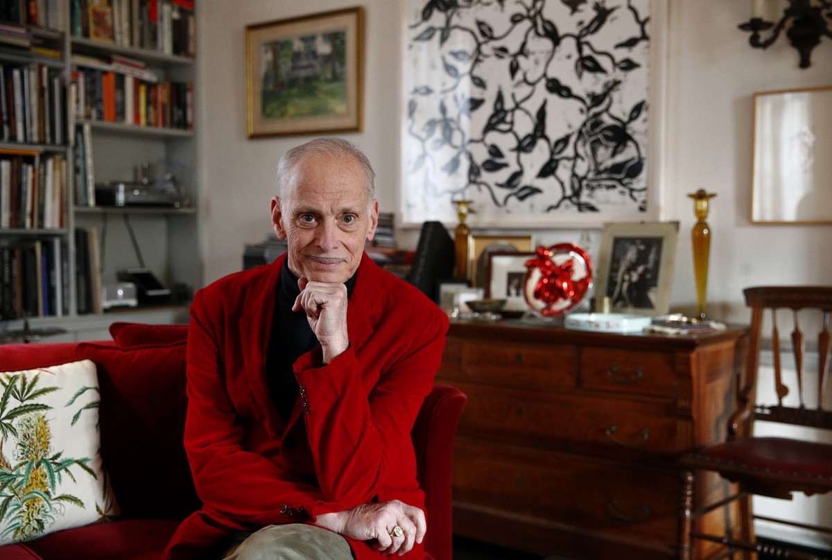 In this Dec. 5, 2017 photo, filmmaker John Waters poses for a photograph during an interview with The Associated Press at his home in Baltimore. "I like it (Christmas) because it's excessive ...