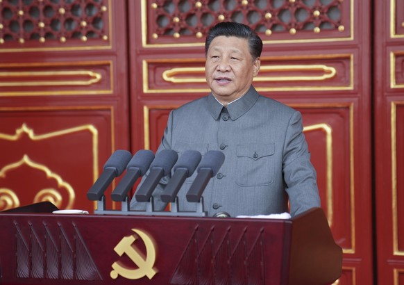 In this photo provided by China&#039;s Xinhua News Agency, Chinese President and party leader Xi Jinping delivers a speech at a ceremony marking the centenary of the ruling Communist Party in Beijing, ...