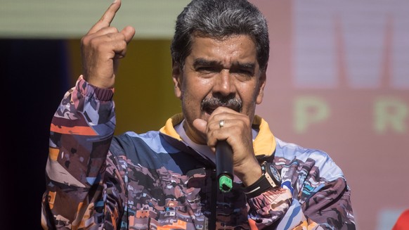 epa11486475 Venezuelan President and presidential candidate Nicolás Maduro delivers a speech during a campaign rally in Caracas, Venezuela, 18 July 2024. Venezuela is scheduled to hold presidential el ...