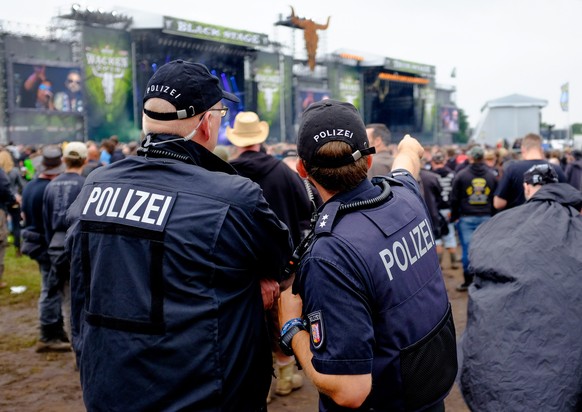 epa05455051 Policemen control the grounds of the Wacken Open Air, in Wacken, Germany, 04 August 2016. The W:O:A festival is the world&#039;s largest heavy metal music event and runs until 06 August. E ...