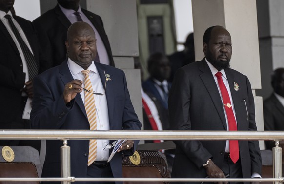 South Sudan&#039;s President Salva Kiir, right, and Vice President Riek Machar, left, attend a Holy Mass led by Pope Francis at the John Garang Mausoleum in Juba, South Sudan Sunday, Feb. 5, 2023. Pop ...
