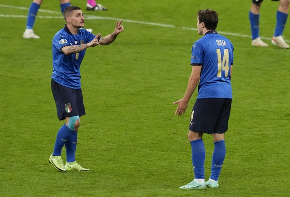 Italy&#039;s Federico Chiesa, right, gestures to teammate Marco Verratti during the Euro 2020 soccer championship semifinal between Italy and Spain at Wembley stadium in London, Tuesday, July 6, 2021. ...