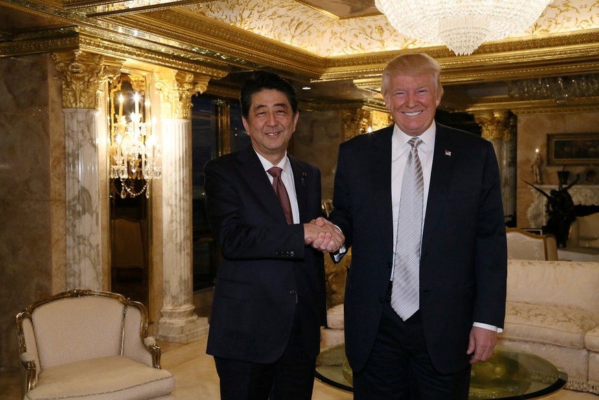 Japan&#039;s Prime Minister Shinzo Abe meets with U.S. President-elect Donald Trump (R) at Trump Tower in Manhattan, New York, U.S., November 17, 2016. Cabinet Public Relations Office/HANDOUT via Reut ...