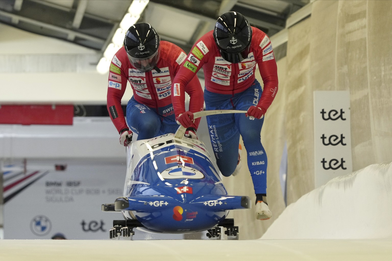 Sandro Michel and Michael Vogt of Switzerland start their first run of the two-man Bobsleigh World Cup race in Sigulda, Latvia, Saturday, Feb. 3, 2024. (AP Photo/Oksana Dzadan)