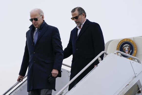 President Joe Biden and his son, Hunter Biden, step off Air Force One, Saturday, Feb. 4, 2023, at Hancock Field Air National Guard Base in Syracuse, N.Y. The Bidens are in Syracuse to visit with famil ...