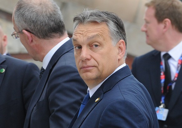 Hungarian Prime Minister Victor Orban arrives for sessions of the second day of the NATO Summit, in Warsaw, Poland, Saturday, July 9, 2016. US President Barack Obama and leaders of the 27 other NATO c ...