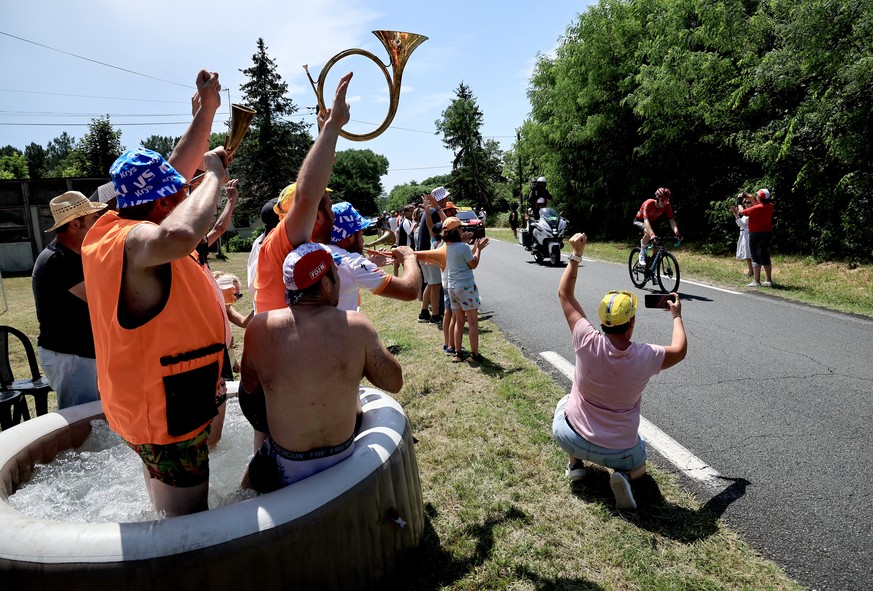 epa10732143 Fans on the side of the road cheer for solo breakaway leader French rider Simon Guglielmi of Team Arkea Samsic in action during the 7th stage of the Tour de France 2023, a 169,9km race fro ...