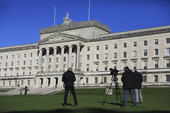 Media wait outside Parliament Buildings, Stormont, Belfast, Northern Ireland, Oct. 28, 2022. The Northern Ireland Secretary of State is due Friday to call an election after political local parties fai ...