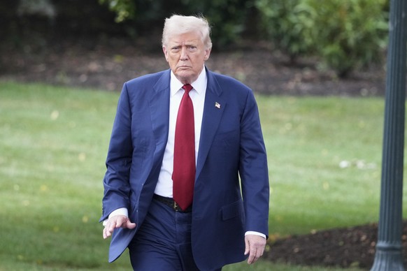 President Donald Trump walks across the South Lawn of the White House to board Marine One en route to Joint Base Andrews, Md., Friday, Aug. 1, 2025, in Washington. (AP Photo/Jacquelyn Martin)
Donald T ...