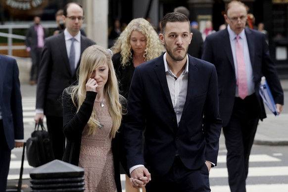 The parents of critically ill baby Charlie Gard, mother Connie Yates, left, and father Chris Gard arrive at the High Court in London, Monday, July 24, 2017. The parents of the 11-month old, Charlie Ga ...