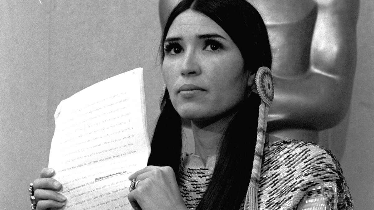 FILE - Sacheen Littlefeather appears at the Academy Awards ceremony to announce that Marlon Brando was declining his Oscar as best actor for his role in "The Godfather," on March 27, 1973. T ...
