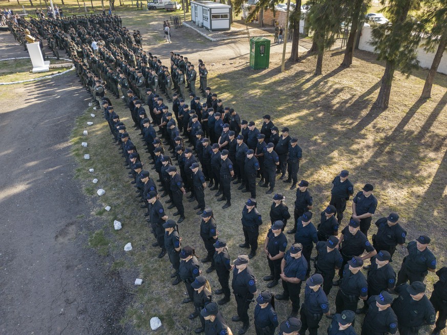 Federal forces who arrived as reinforcements for provincial police stand in formation in Rosario, Argentina, Wednesday, March 8, 2023. Argentina?s president said Tuesday he will send hundreds more fed ...