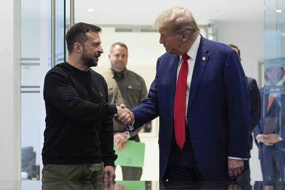 FILE - Republican presidential nominee former President Donald Trump, right, and Ukraine&#039;s President Volodymyr Zelenskyy shake hands during their meeting at Trump Tower, on Sept. 27, 2024, in New ...