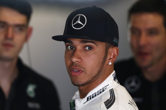 Mercedes driver Britain&#039;s Lewis Hamilton stands inside his box during the second practice session for the Spain Formula One Grand Prix at the Barcelona Catalunya racetrack in Montmelo, just outsi ...