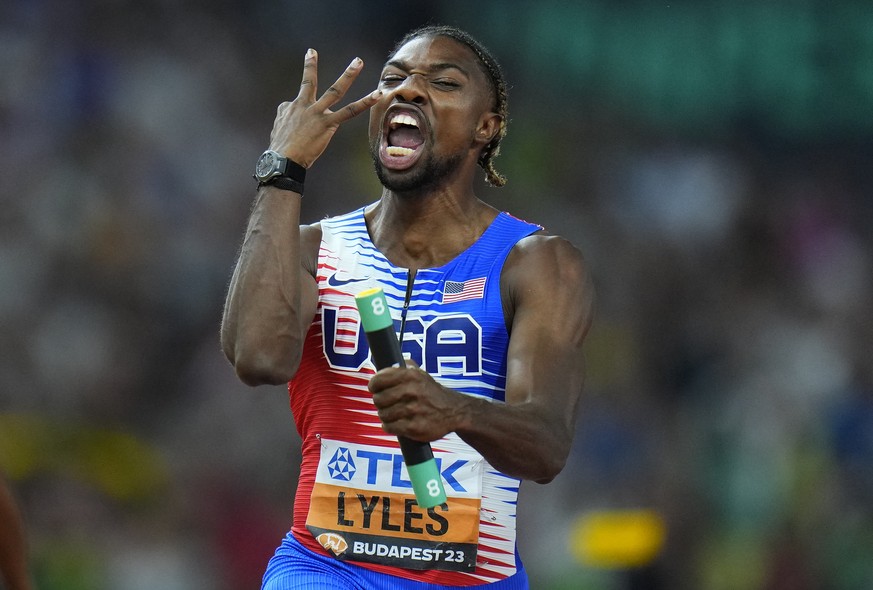 Noah Lyles, of the United States celebrates anchoring his team to gold in the Men&#039;s 4x100-meters relay final during the World Athletics Championships in Budapest, Hungary, Saturday, Aug. 26, 2023 ...