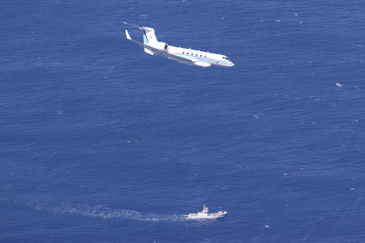 Rescuers conduct a search operation in waters near Shiretoko Peninsula in northern Japan of Hokkaido Sunday, April 24, 2022. The Japanese Coast Guard said Sunday that rescue helicopters found nine of  ...