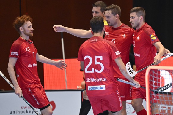 Switzerland celebrates after Paolo Riedi, right, scored 2-2 in action during the friendly floorball game between Switzerland and Finland at the Euro Floorball Tour, on Friday, September 2, 2022, in St ...