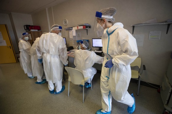 Doctors and nurses work in the emergency COVID-19 ward at the Mellino Mellini hospital in Chiari, northern Italy, Monday, March 8, 2021. The UK variant surged has filled 90% of hospital beds in Bresci ...