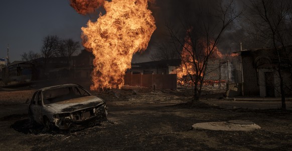 Flames and smoke rise from a fire following a Russian attack in Kharkiv, Ukraine, Friday, March 25, 2022. (AP Photo/Felipe Dana)