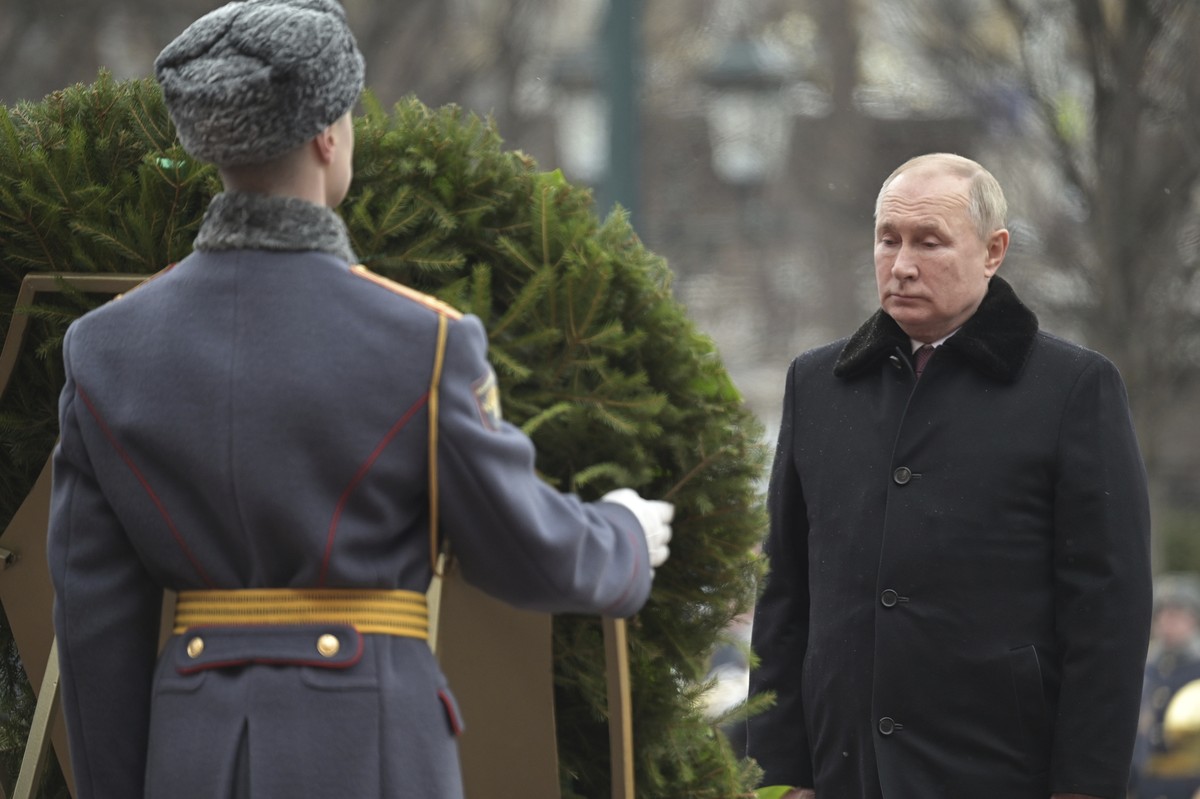 Russian President Vladimir Putin attends a wreath-laying ceremony at the Tomb of the Unknown Soldier, near the Kremlin Wall during the national celebrations of the 'Defender of the Fatherland Day ...