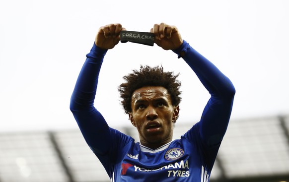 Britain Football Soccer - Manchester City v Chelsea - Premier League - Etihad Stadium - 3/12/16 Chelsea&#039;s Willian celebrates scoring their second goal holds a armband in respect for the victims o ...