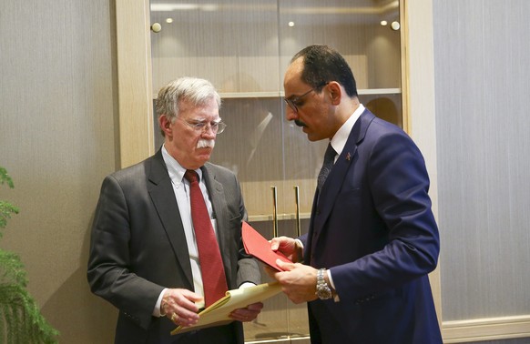 epa07269232 A handout photo made available by Turkish Presidential Press Office shows Turkish Presidential Spokesperson Ibrahim Kalin (R) and US National Security Advisor John Bolton (L) during their  ...